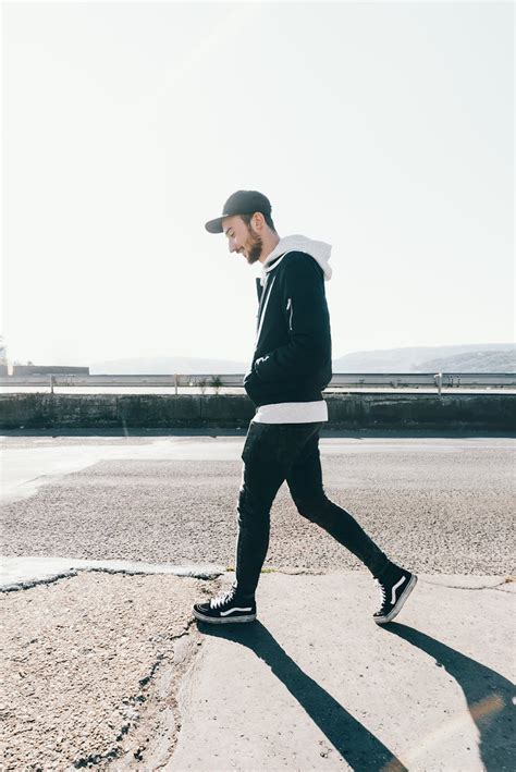 Man Walking On Road Under The Sun · Free Stock Photo