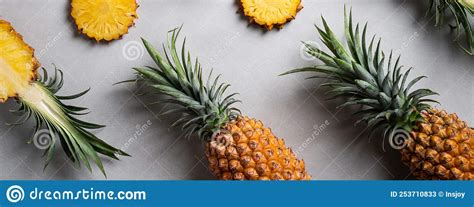 Fresh Cut Pineapple With Tropical Leaves On Dark Blue Background Stock