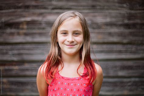 Headshot Of Nine Year Old Girl With Brown And Red Hair By Stocksy