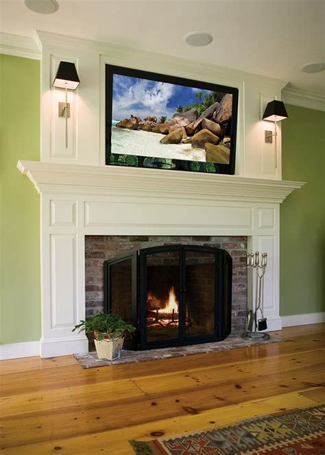 A Custom Built In Fireplace Mantel With Tv Mounted Above Fireplace