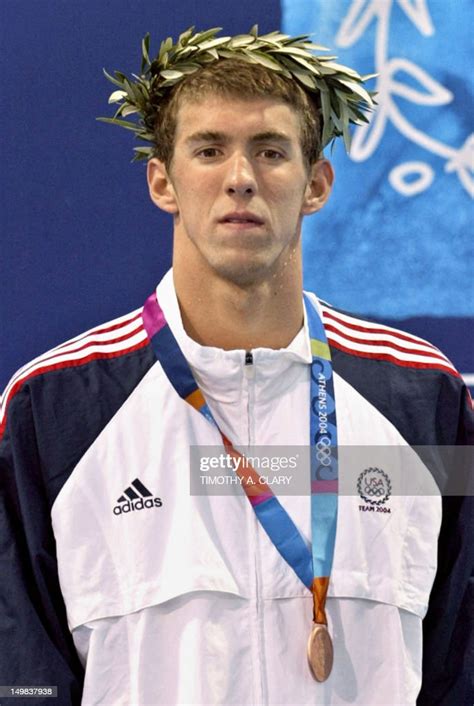 us michael phelps poses on the podium after winning the men s 200m news photo getty images