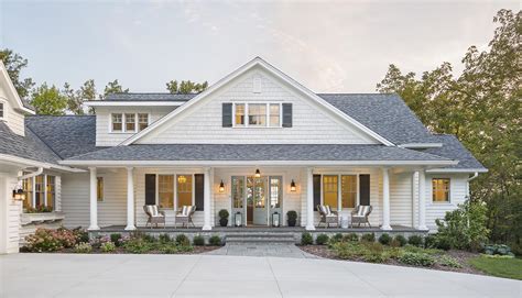 Exterior Of White Cottage Style House With Large Open Porch Andrea