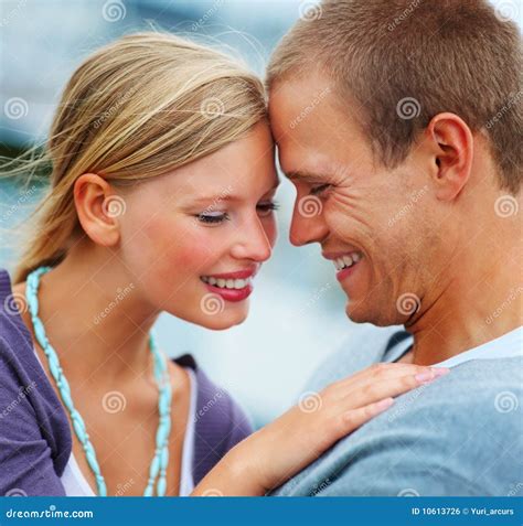 Closeup Of A Romantic Young Couple Smiling Stock Photo Image Of