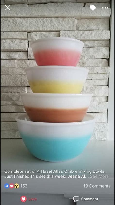Three Bowls Stacked On Top Of Each Other In Front Of A White Brick Wall