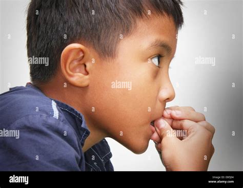 Boy Biting His Nails Stock Photo Alamy