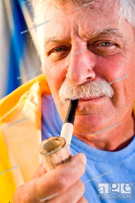 Senior Man Smoking Pipe Stock Photo Picture And Royalty Free Image