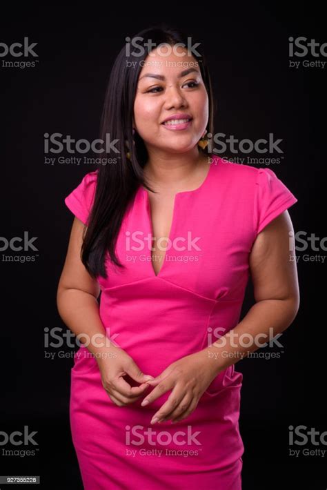 Beautiful Plus Size Woman Model Smiling Against Black Background Stock