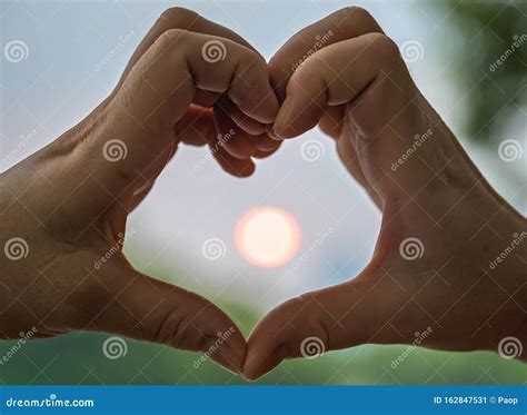Woman S Hands Catching Sun In A Love Sign Stock Image Image Of Faith