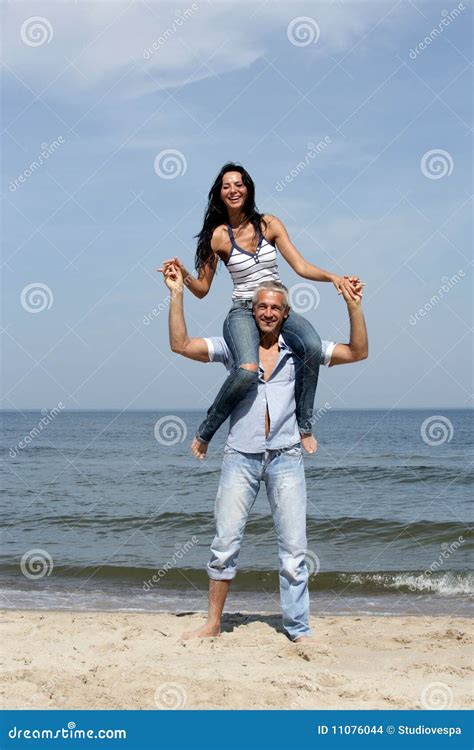 Woman Riding On Man S Shoulders Stock Photo Image Of Cheerful Blue