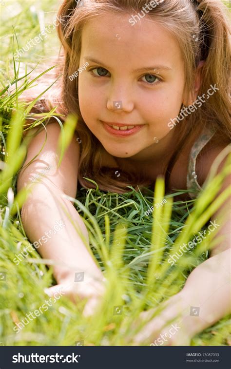 Young Girl Laying Down Grass Stock Photo Edit Now 13087033