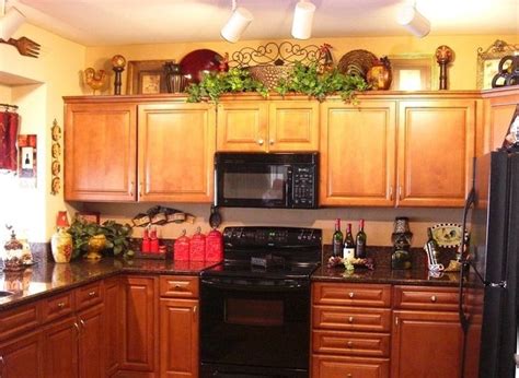 Storage is maximized with a wall of cabinets, floor to ceiling. Wine themed kitchen paint ideas - Decolover.net