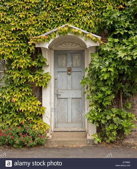 Stock Photo Decorative Door To English Cottage With Arched Portico
