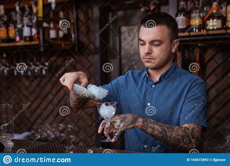 Handsome Male Tattooed Bartender Preparing A Drink Stock Image Image