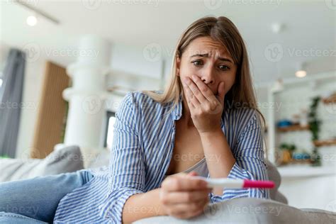 Shocked Woman Looking At Control Line On Pregnancy Test Single Sad