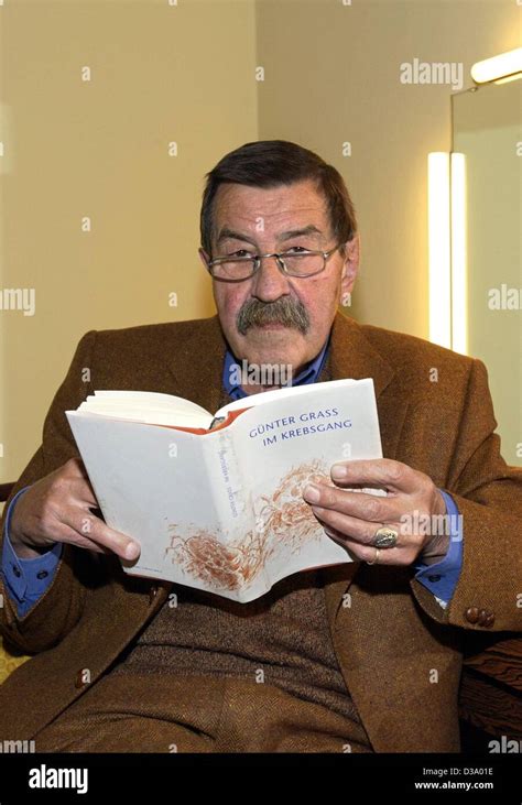 German Author Guenter Grass Is Holding His Book Im Krebsgang In