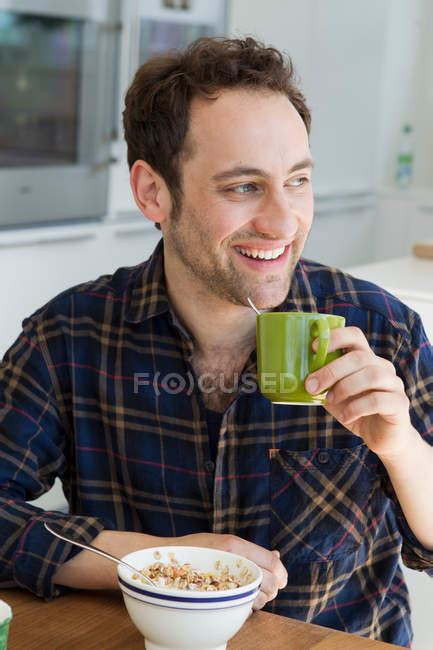 Man Having Breakfast At Table — People Indoors Stock Photo 165474966