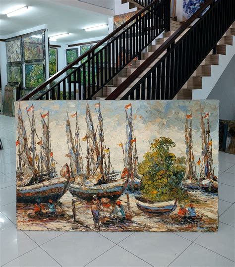 Three Paintings Of Boats Are On Display In A Lobby With Stairs Leading