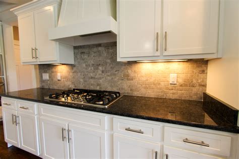 Gray Stone Subway Tile Backsplash White Cabinets And Dark Granite