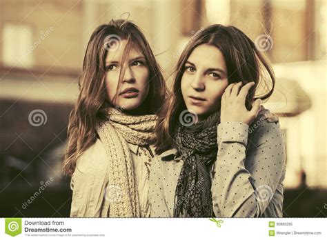 Two Young Fashion Girls Walking In A City Street Stock Image Image Of