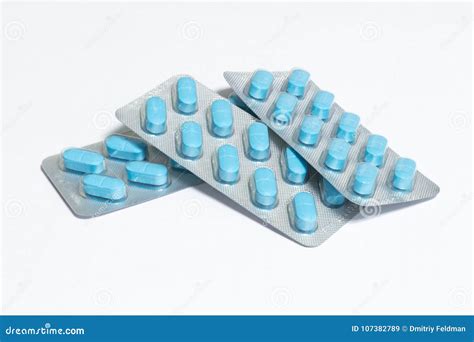 Three New Packs of 10 Blue Oblong Pills Isolated on a White Background