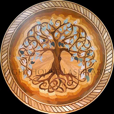 A Wooden Plate With A Tree Painted On It