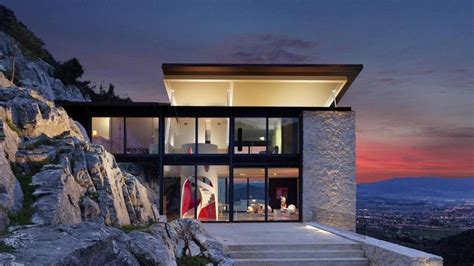 A Modern House On Top Of A Rocky Hill