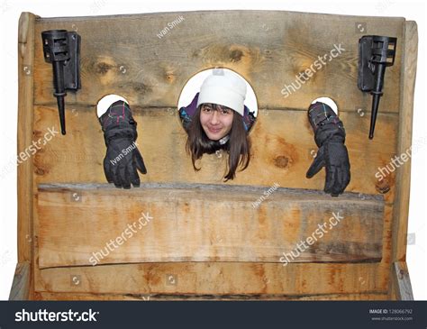 Young Girl Trapped Medieval Torture Device ภาพสต็อก 128066792