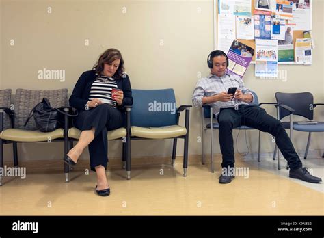 People Sitting And Waiting In A Hospital Waiting Room In Toronto
