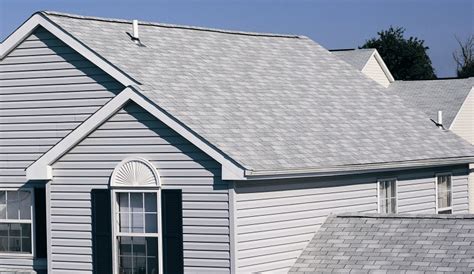 In this case, the home appears more sedate and comfortable, while some decorative shingles beneath the roofline help to give it some depth. Belmont Luxury Shingles | American Roofing & Renovation