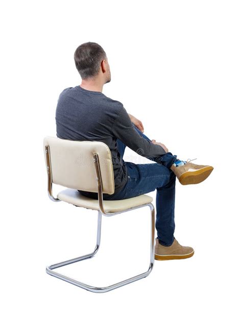 Side View Of A Man Sitting On A Chair Stock Photo Image Of Male