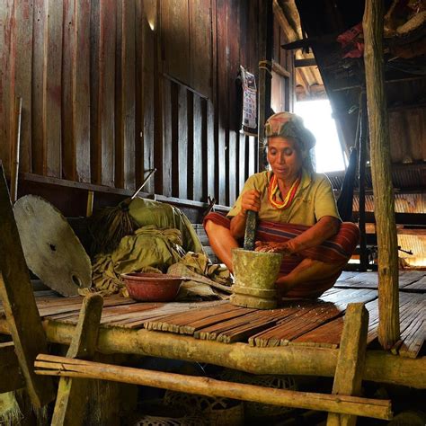 a-hmong-lady-grinding-rice-for-dinner-this-was-taken-in-a-hmong-village-outside-mae-sariang