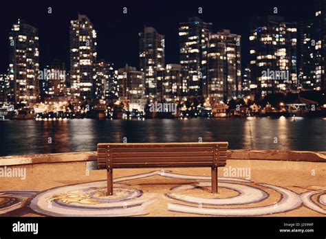 Vancouver City Night With Bench At Waterfront With Buildings Stock