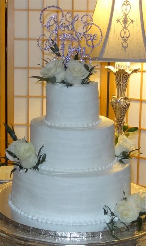 Need wedding cake ideas but don't know where to start? Elegant all white wedding cake with white rose accents ...