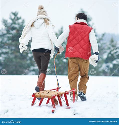 Couple In Winter Pulling A Sled Stock Photo Image Of Pull Winter