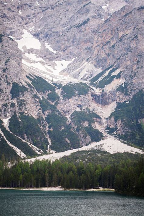 Mudflow With Snow High In The Alpine Mountains Lake Lago Di Braies