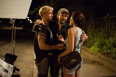 Actor Ryan Gosling Director Derek Cianfrance And Actress Eva Mendes Embrace On The Set Of The