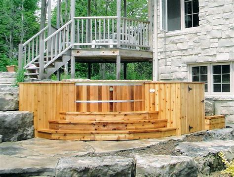 An 7 X 5 X 4 Deep Oval Cedar Hot Tub Installed In A Red Cedar Deck For More Info