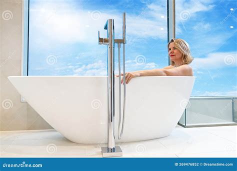 Woman In Freestanding White Bath Modern Bathroom Interior Design Stock