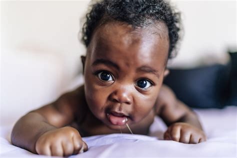 Free Photo Adorable African American Baby Lying In Bed And Smiling