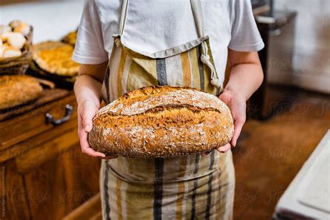 Anonymous Baker Showing Beautiful Bread Loaf In A Bakery Stocksy United Loaf Bread Anonymous
