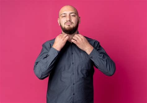 Free Photo Confident Young Bald Call Center Man Grabbing Collar Of