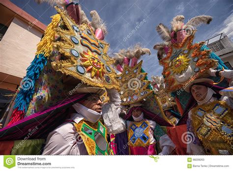 heavy-elaborate-bright-colour-headdresses-in-pujili-ecuador-editorial