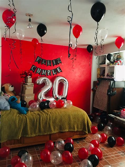 the room is decorated with red black and white balloons that spell out the number 20
