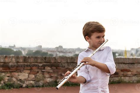 Happy Kid Playing Flute 10909527 Stock Photo At Vecteezy