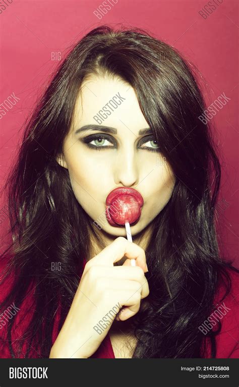 girl licking lollipop image and photo free trial bigstock