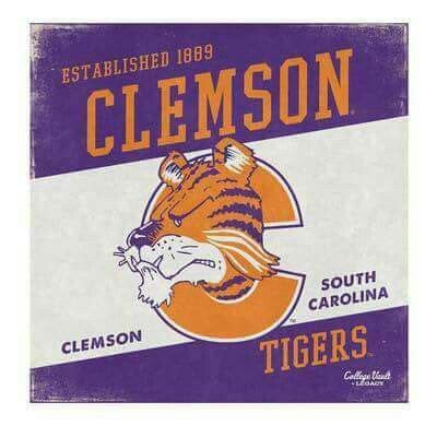 The Clemson Tigers Logo Is Shown On An Old Fashioned Metal Sign That