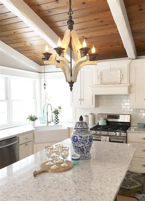 I have always loved the look of them but wanted to make it a bit fancier and paint it white. White kitchen with wood plank ceiling | Wood plank ceiling ...