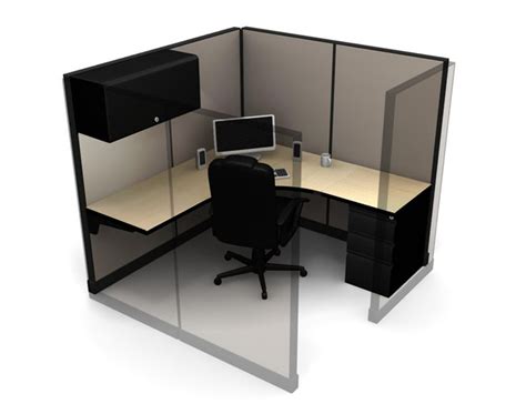 An Office Cubicle With A Computer On The Desk