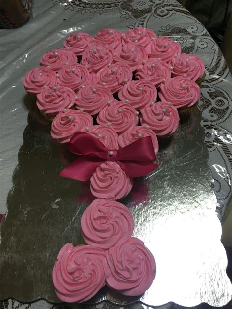 You can purchase duckies from a party supply or. Baby shower. Baby rattle cupcake cake | Baby shower ...