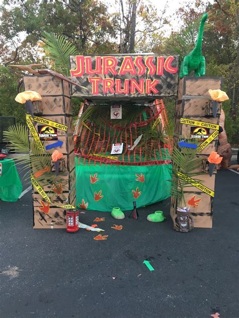 An Outdoor Display With Various Items On The Ground And In Front Of It That Says Jurrastic Trunk